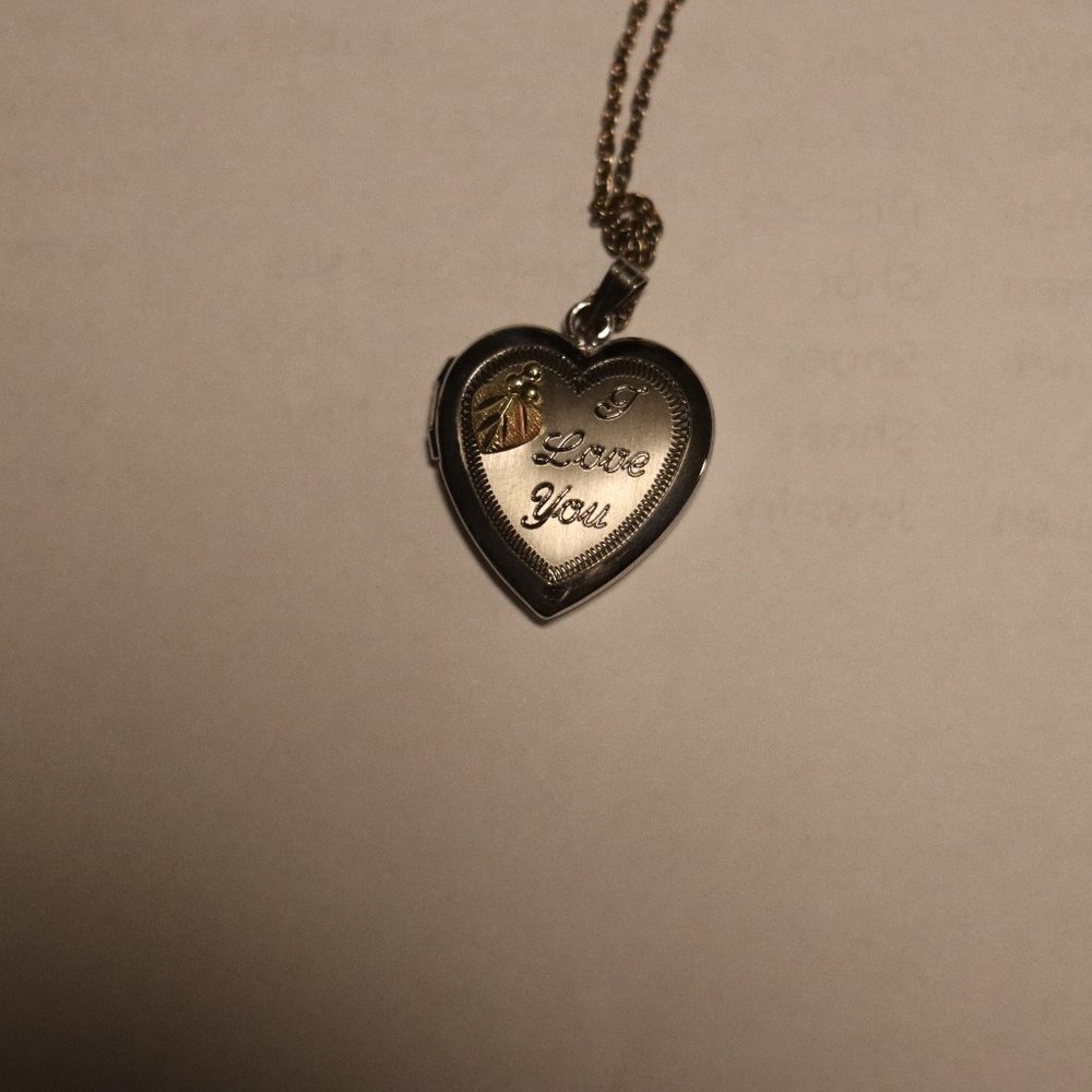 "I Love You" hear shaped locket with black hills gold/tri-colored